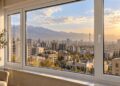 پنجره UPVC آپارتمان با چشم‌انداز شهر تهران و برج میلاد